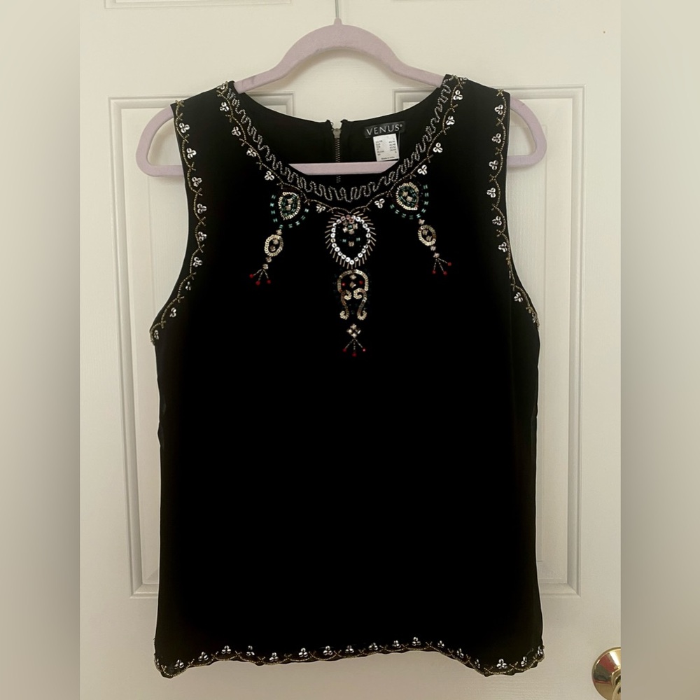 Beautiful never worn beaded top. Great for the upcoming holidays.